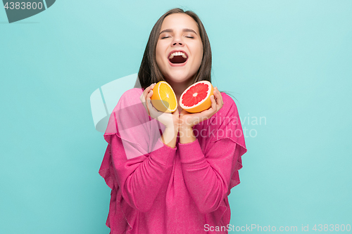 Image of Beautiful woman\'s face with juicy orange