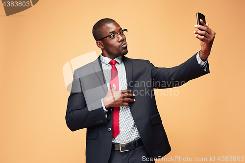 Image of Young african business man on the phone