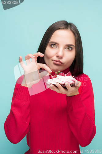 Image of Beautiful women holding small cake. Birthday, holiday.