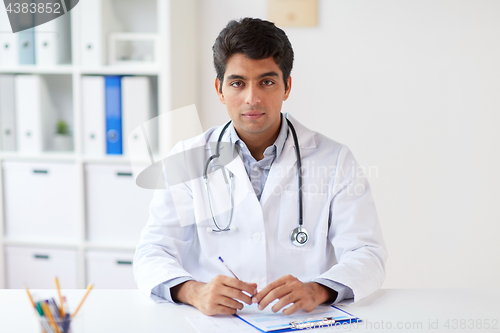 Image of doctor with stethoscope and clipboard at clinic