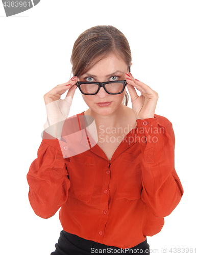 Image of Woman looking over her glasses