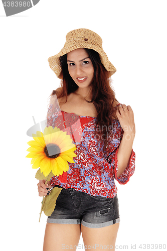 Image of Beautiful woman with a sunflower