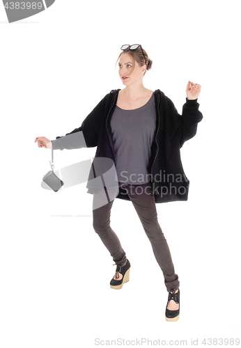 Image of Pretty girl in jeans and jacket