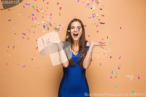 Image of The woman celebrating birthday on brown background