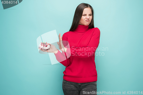 Image of Beautiful women holding small cake. Birthday, holiday.