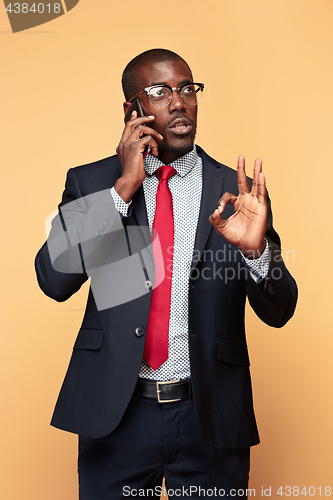 Image of Young african business man on the phone