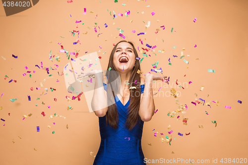Image of The woman celebrating birthday on brown background