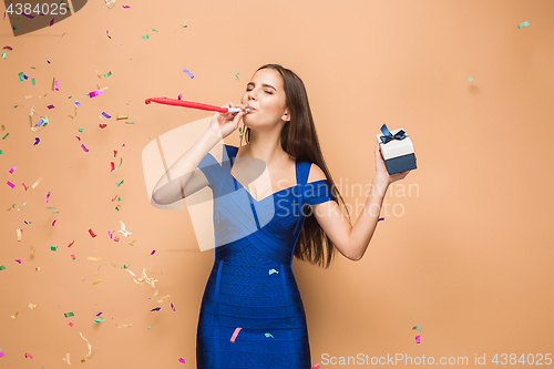 Image of The woman celebrating birthday on brown background