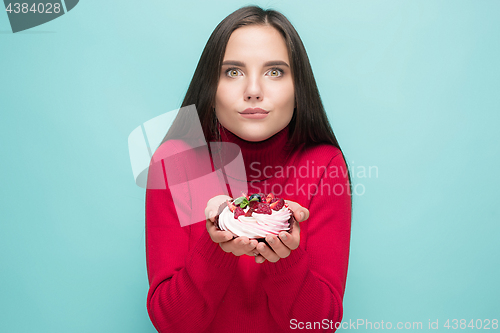 Image of Beautiful women holding small cake. Birthday, holiday.