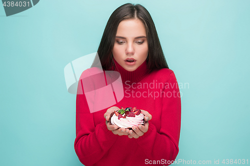 Image of Beautiful women holding small cake. Birthday, holiday.