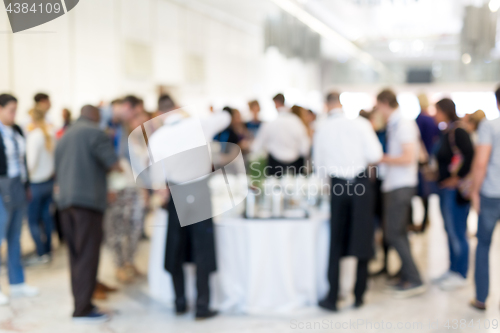 Image of Blured image of businesspeople at coffee break at conference meeting.