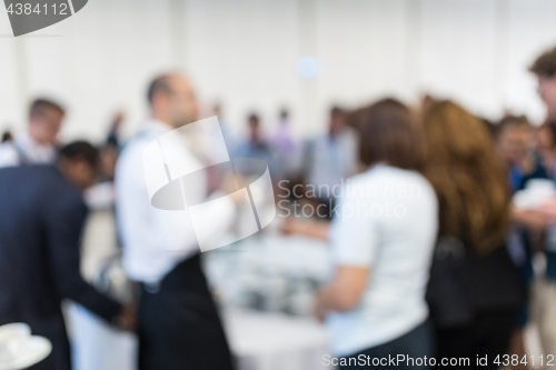 Image of Blured image of businesspeople at coffee break at conference meeting.