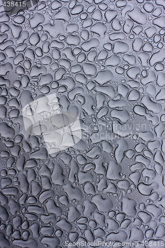 Image of raindrops on metal