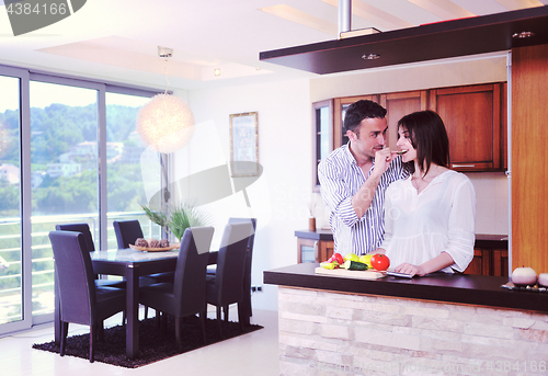 Image of happy young couple have fun in modern kitchen