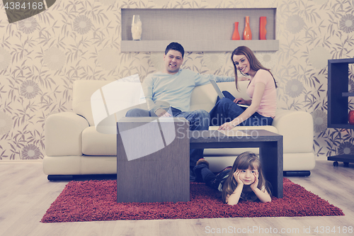 Image of happy young family at home