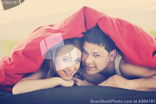 Image of young couple in bed