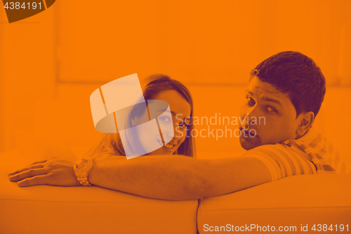 Image of couple relaxing at home