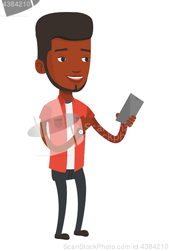 Image of Young smiling man holding mobile phone.