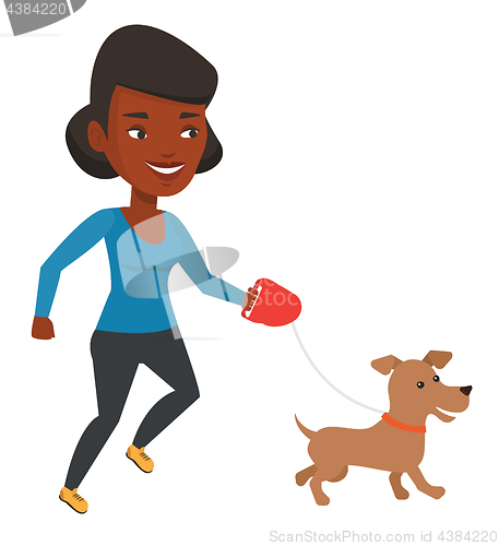 Image of Young woman walking with her dog.