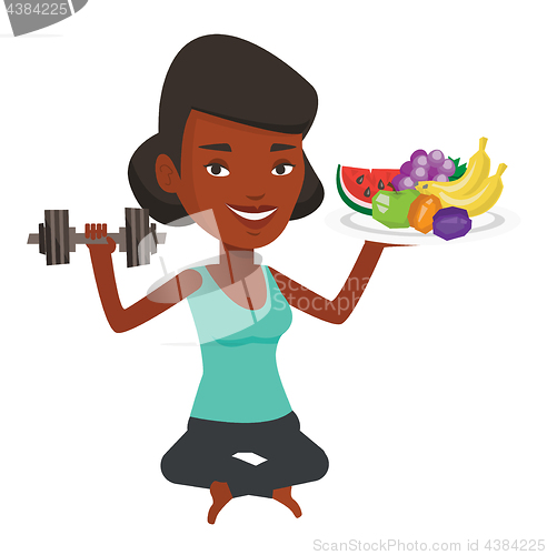 Image of Healthy woman with fruits and dumbbell.