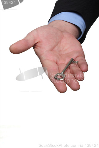 Image of hand and key