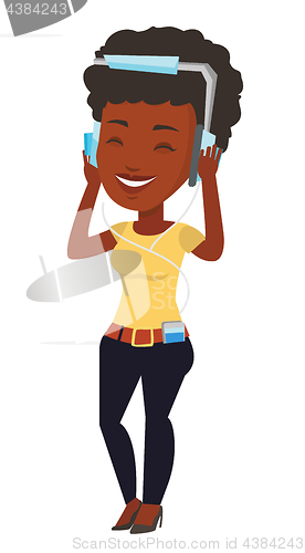 Image of Young woman in headphones listening to music.