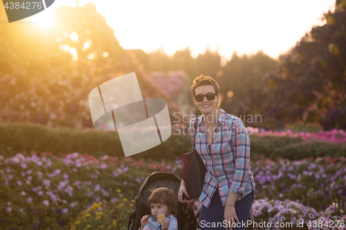 Image of mother and daughter in flower garden