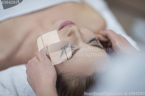 Image of woman receiving a head massage