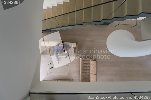 Image of mother and her cute little daughter are using a tablet top view