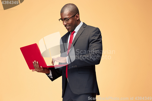 Image of Handsome Afro American man using a laptop