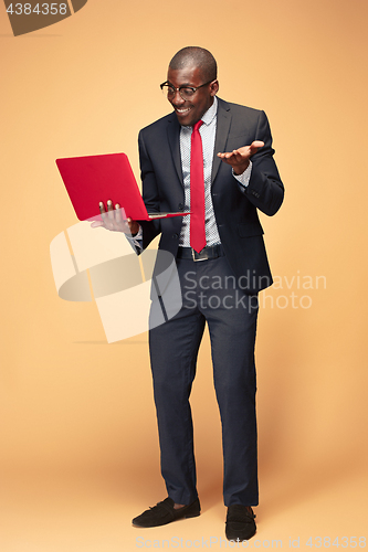 Image of Handsome Afro American man using a laptop