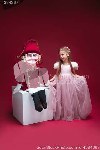 Image of The beauty ballerina standing with nutcracker