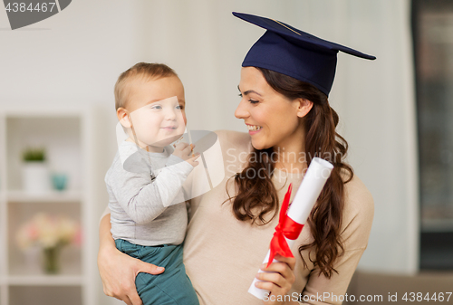 Image of mother student with baby boy and diploma at home