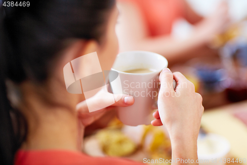 Image of close up of woman with cup of coffee