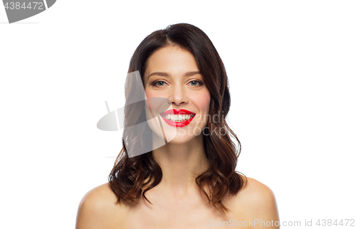 Image of beautiful smiling young woman with red lipstick