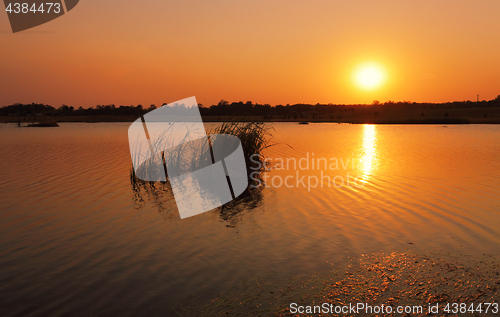 Image of Hot sun rising over Boorooberongal Lake