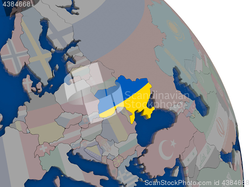 Image of Ukraine with flag on globe