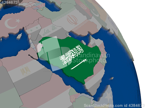 Image of Saudi Arabia with flag on globe