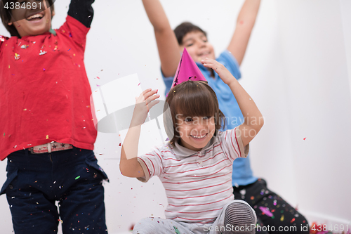 Image of kids  blowing confetti