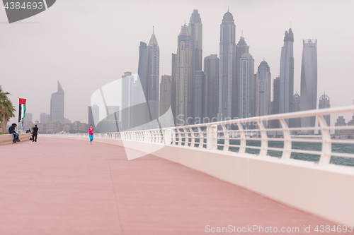 Image of woman running on the promenade