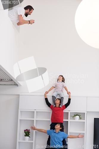 Image of young boys posing line up piggyback