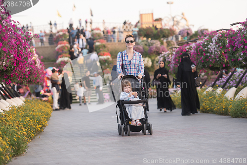 Image of mother and daughter in flower garden