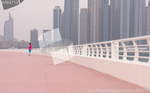 Image of woman running on the promenade