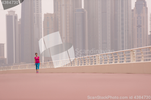 Image of woman running on the promenade