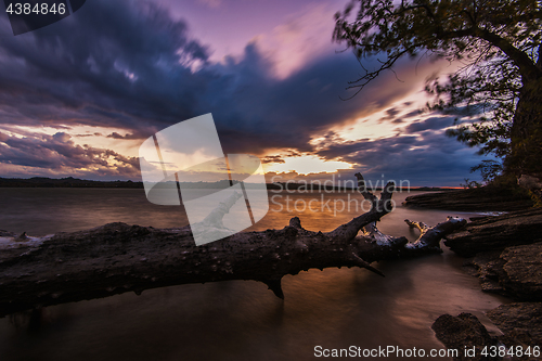 Image of Landscape with sunset and snag