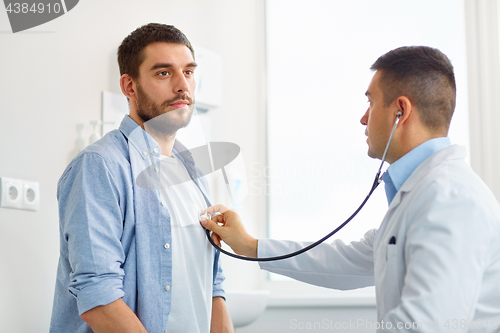 Image of doctor with stethoscope and patient at hospital