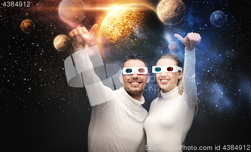 Image of couple in 3d glasses looking at space projection