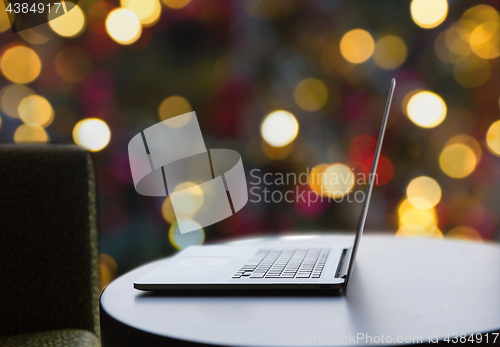 Image of close up of laptop computer on table at christmas