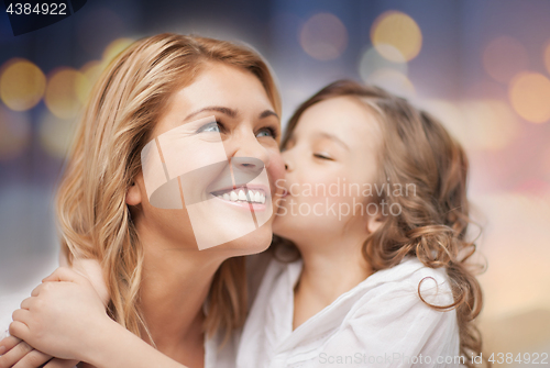 Image of happy mother with daughter hugging and kissing