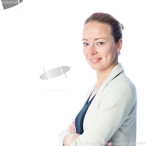 Image of Business woman standing with arms crossed against white background.